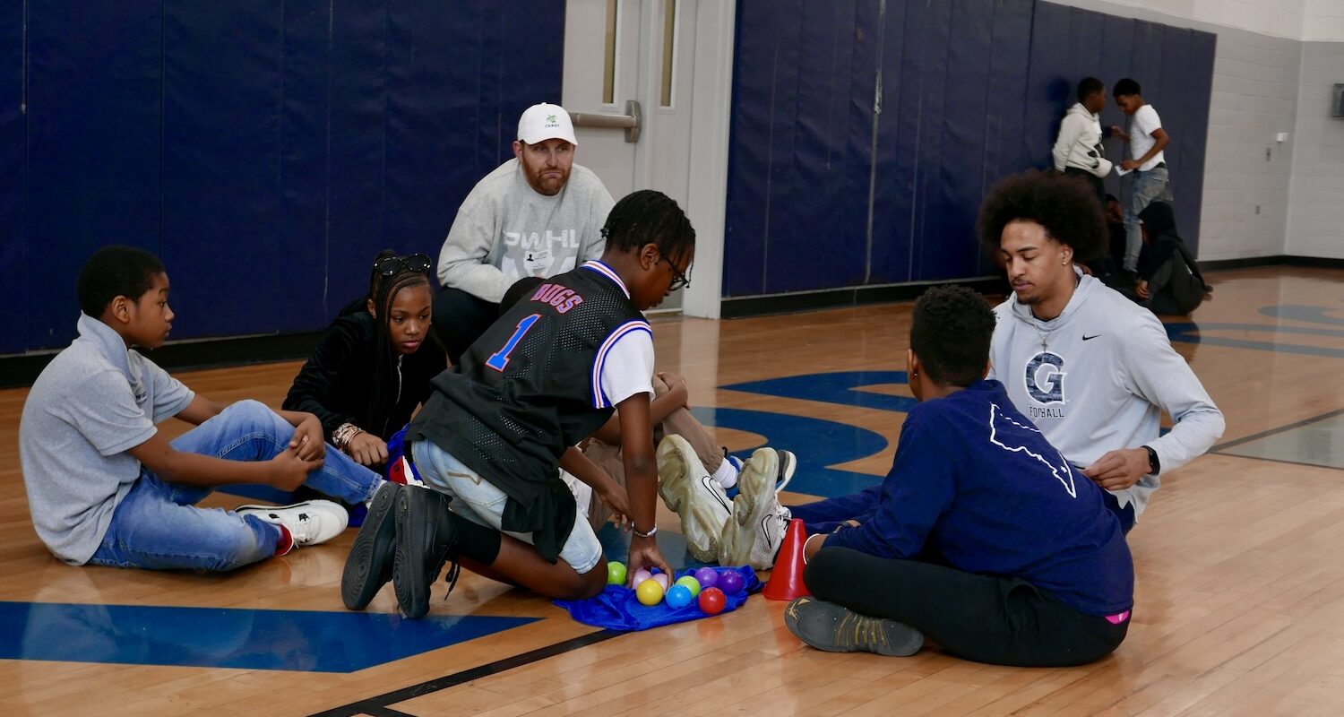 Karl Alzner listening in on small group discussion led by Keynan (a.k.a. "Chef K") Richardson-Cook