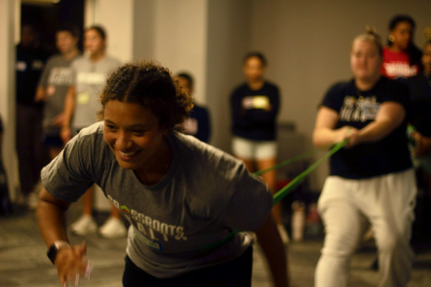 Naomi Green playing Stress Football with Resistance Band at Fall 2026 Volunteer Training [Shannon Fawkes Photography]